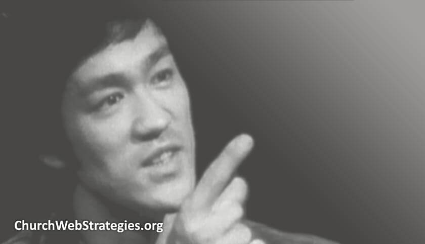 close-up photo of Bruce Lee talking