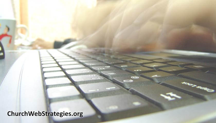 fingers typing on a laptop keyboard