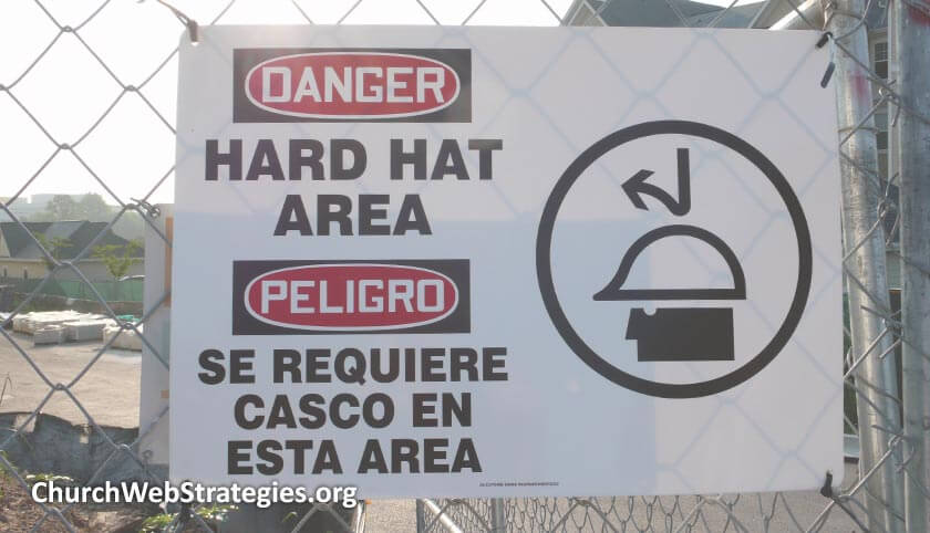 warning sign about wearing hard hats