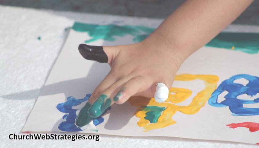 child's hand finger painting