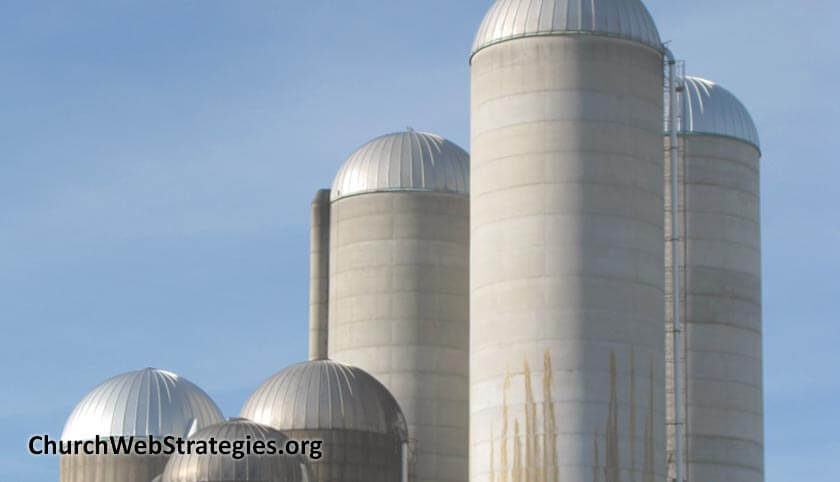 several grain silos on a farm