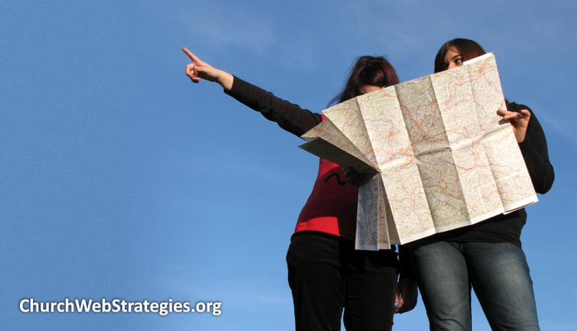two women looking at a road map